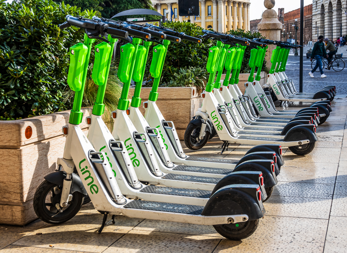 Verona, Italy - November 8: typical modern parked escooter at  a sidewalk in the old town of Verona on November 8, 2022